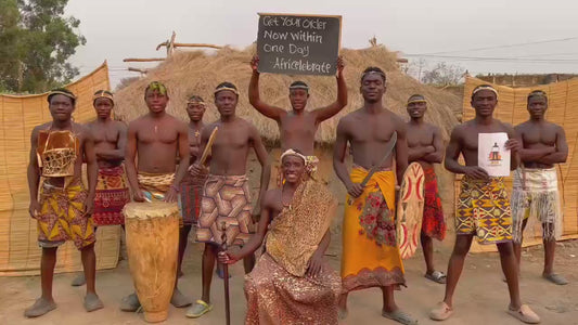 Traditional African village drummers and chief holding a personalized sign